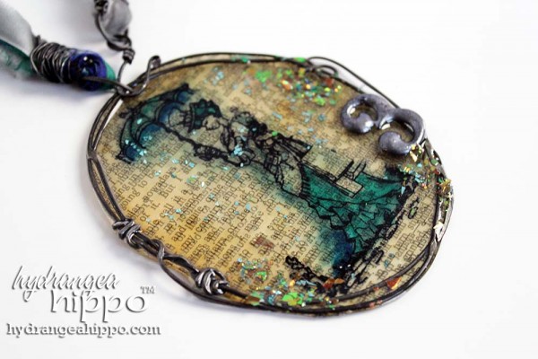 Jennifer Priest showed how to make this beautiful resin paper pendant. Great for Halloween parties or everyday accessory! Check out the video tutorial! 