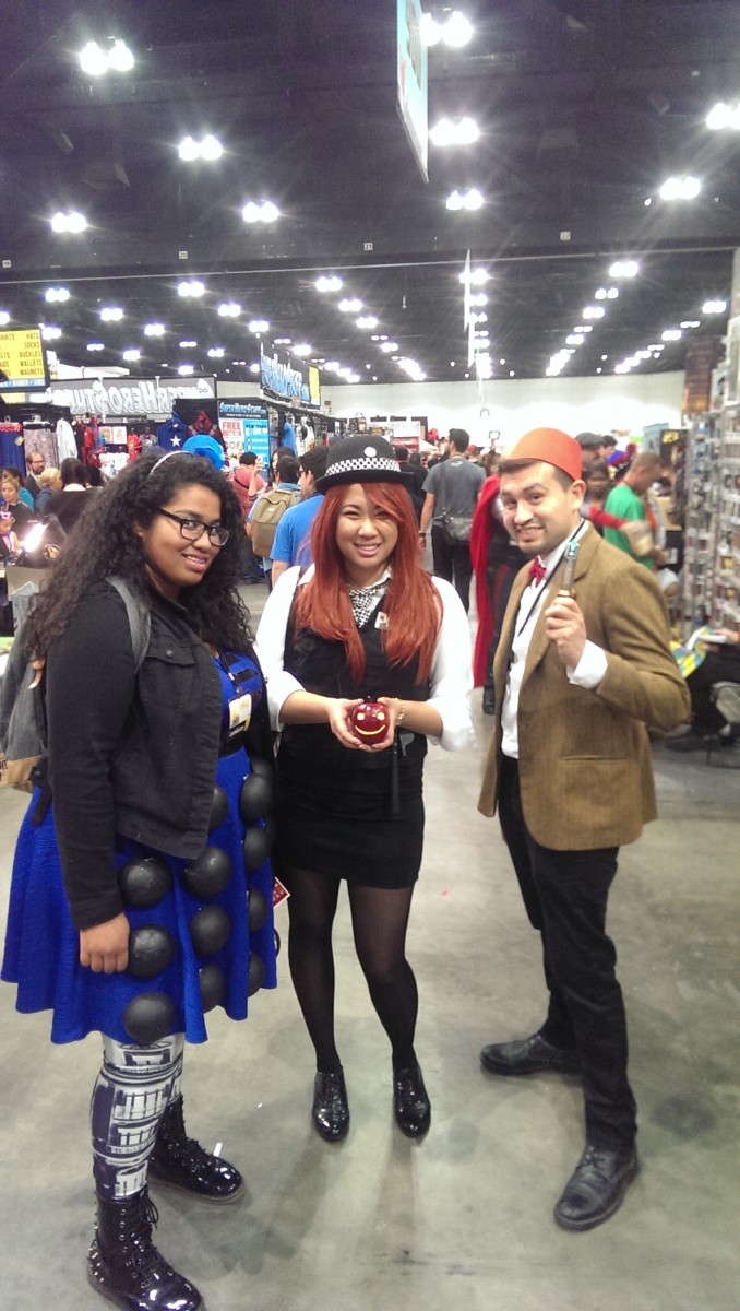 Dr, Who cosplayers, the 11th Doctor and Amy, pose with Katie in her Dalek Dress