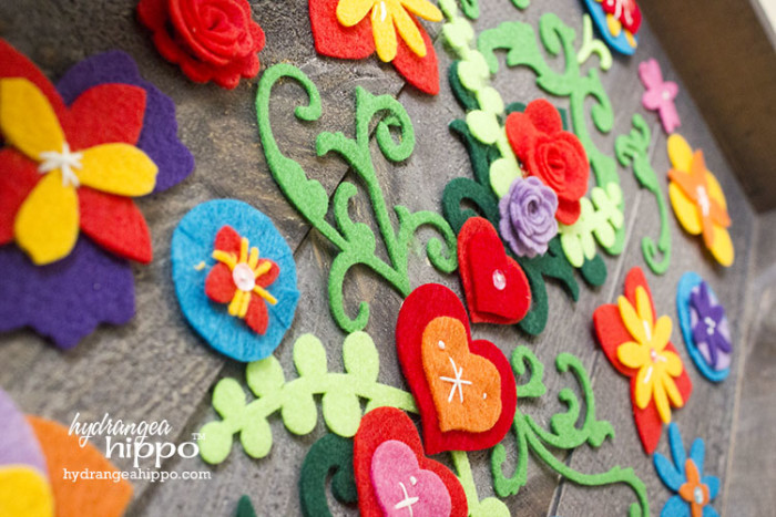 Felt Flower Collage on Wood JPriest - Create this garden wall art for your garden decor with flowers made from Kunin felt and a Walnut Hollow Rustic Panel. Flowers made with SIizzix dies.